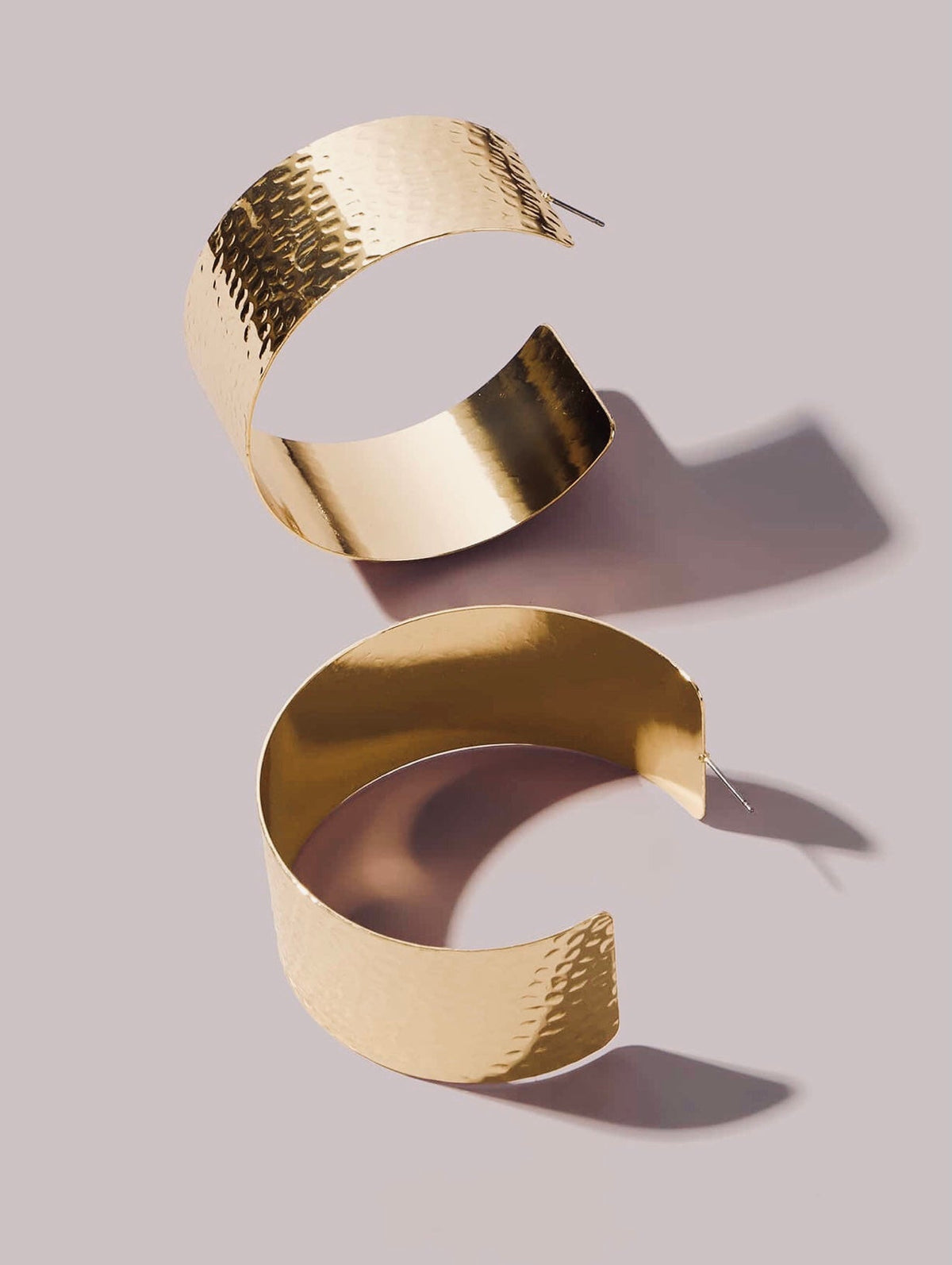 Gold Ridged Hoop Earrings by The Glam Vault with textured yellow-gold ridged finish and oversized hoop design